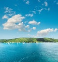 Turquoise sea water perfect blue sky white clouds Royalty Free Stock Photo