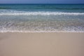 Turquoise sea wave foam on Ajman beach, United Arab Emirates