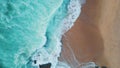 Turquoise sea waves crashing on sandy coast aerial view. Ocean washing seashore Royalty Free Stock Photo