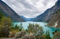 Turquoise Seton Lake between mountain ranges.