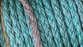 Turquoise ship mooring rope on a reel close-up Royalty Free Stock Photo