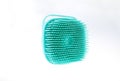 turquoise silicone scrubber cleaning brush with handle, soft body exfoliator for shower and cleaning, isolated on white background Royalty Free Stock Photo