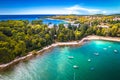 Turquoise stone beach in Rovinj aerial view, pine trees archipelago Royalty Free Stock Photo