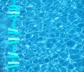 Turquoise summer theme arrows on pool water