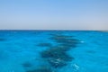 Turquoise swallow lagoons with sea corals in the Red Sea. Crystal clear water over a coral reef in Marsa Alam, Egypt. Coral atolls Royalty Free Stock Photo