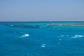 Turquoise swallow lagoons with sea corals in the Red Sea. Crystal clear water over a coral reef in Marsa Alam, Egypt. Coral atolls Royalty Free Stock Photo