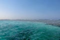 Turquoise swallow lagoons with sea corals in the Red Sea. Crystal clear water over a coral reef in Marsa Alam, Egypt. Coral atolls Royalty Free Stock Photo