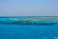 Turquoise swallow lagoons with sea corals in the Red Sea. Crystal clear water over a coral reef in Marsa Alam, Egypt. Coral atolls Royalty Free Stock Photo