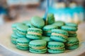 Turquoise sweet macarons candy on white plate