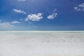 Turquoise, tranquil ocean merging with clear beautiful sky at horizon line on sunny warm day Royalty Free Stock Photo