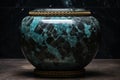 Turquoise vase with intricate golden patterns on dark marble table - detailed close-up