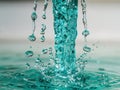 Turquoise water droplets in motion Royalty Free Stock Photo