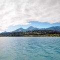 Turquoise water of Faaker See with Alps, Austria Royalty Free Stock Photo
