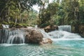 Turquoise water of Kuang Si waterfall, Luang Prabang. long exposure. Beautiful scenery. Waterfall in the wild jungle. Asian nature