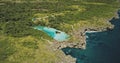 Turquoise water lake at green forest of Weekuri lagoon at Sumba Island, Indonesia. Limpid loch Royalty Free Stock Photo