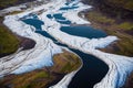 Turquoise water and white snow on Iceland aerial river