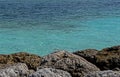 Big rocks and turquoise waters are in the Bahamas. Royalty Free Stock Photo