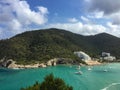 Turquoise waters and pine covered hills of Cala Llonga bay, Med Royalty Free Stock Photo