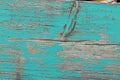 Turquoise wooden board with flaking color