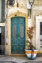 The turquoise wooden door on the promenade in Olhao, Portugal