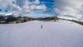 Turrach - A girl going down a snowy slope on a snowboard