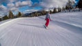 Turrach - A girl going down a snowy slope on a snowboard Royalty Free Stock Photo