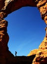 Turret Arch in Canyon Rock Formations Silhouetter of Hiker