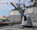 Turret containing a 5-inch gun on the deck of US Navy Ticonderoga-class cruiser Royalty Free Stock Photo