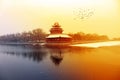 The turrets of the Forbidden City in Beijing under the sunset after snow. Royalty Free Stock Photo