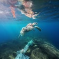 Turtle entangled in polyethylene underwater
