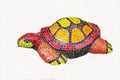 A turtle figurine made of a mosaic of yellow red color isolated on a white background.