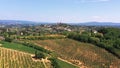 Tuscan countryside shot with drone at summer time of wine fields. Aerial view of amazing cultivated fields in hot