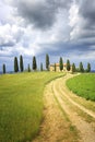 Tuscan Farmhouse with pine trees on a hill Royalty Free Stock Photo