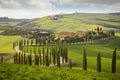 Tuscan hill with row of cypress trees and farmhouses. Tuscan landscape. Italy Royalty Free Stock Photo