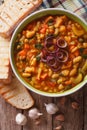 Tuscan ribollita soup close up in a bowl. Vertical top view Royalty Free Stock Photo