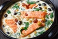 Tuscan salmon with cream sauce on a black dish Royalty Free Stock Photo