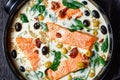 Tuscan salmon with cream sauce on a black dish Royalty Free Stock Photo