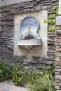 Tuscan Style Wall Water Fountain in Courtyard Royalty Free Stock Photo