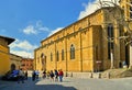 TUSCANY, AREZZO. tourists on the stairs in front of medieval San Pietro and Donato historical cathedral with facade of