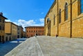 TUSCANY, AREZZO. tourists on the stairs in front of medieval San Pietro and Donato historical cathedral with facade of