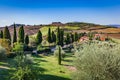 Tuscany countryside landscape with cypress trees, farms and green fields, Italy. Royalty Free Stock Photo