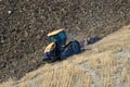 The catarpillar Challenger MT765D on plowing of the field. Tuscany, Italy