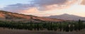 Tuscany landscape with cypress trees, hills and farms trees, hills and farms at sunset Royalty Free Stock Photo