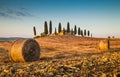 Tuscany landscape with farm house at sunset Royalty Free Stock Photo