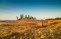 Tuscany landscape with farm house at sunset, Val d'Orcia, Italy Royalty Free Stock Photo