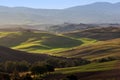 Tuscany landscape at sunrise. Tuscan farm house, vineyard, green hills. Royalty Free Stock Photo