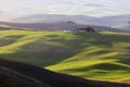 Tuscany landscape at sunrise. Tuscan farm house, vineyard, green hills. Royalty Free Stock Photo