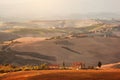 Tuscany landscape at sunrise. Tuscan farm house, vineyard, hills. Royalty Free Stock Photo