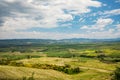 Tuscany landscape at sunrise. Typical for the region tuscan farm house, hills, vineyard. Italy Royalty Free Stock Photo