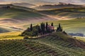 Tuscany landscape with traditional farm house, hills and meadow. Val d`orcia, Italy.